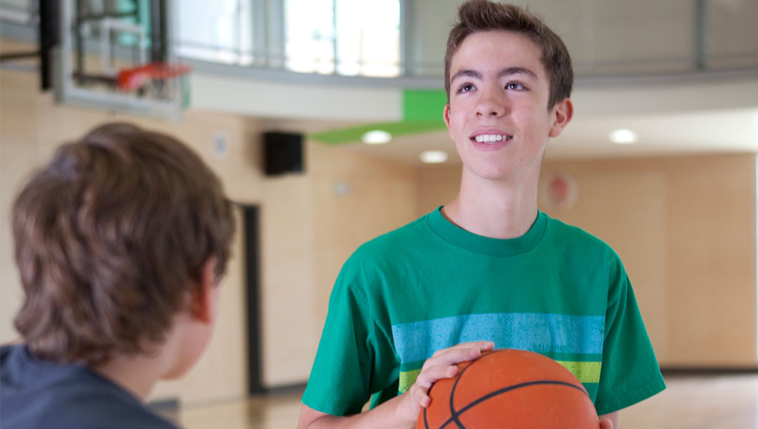 youth playing basketball in the gymnasium