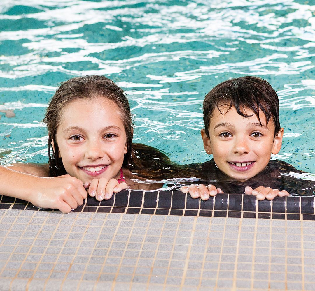 two happy children in a pool