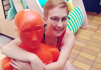 Sophie posing with a mannequin 