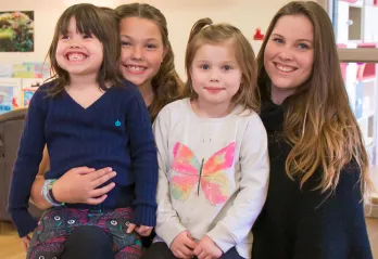 Ali and kids in child care room