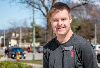Bryan Smiling in front of the YMCA