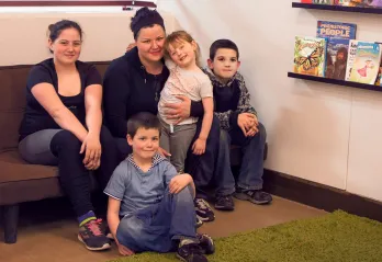 Dannie and kids in YMCA Beyond the Bell reading area