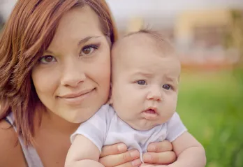 mother holding her baby