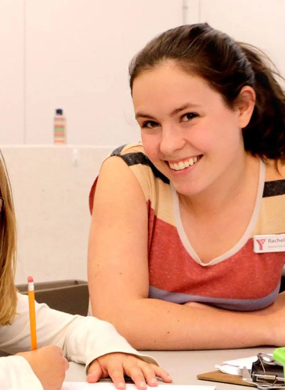 girl getting help with her homework at YMCA Beyond the Bell