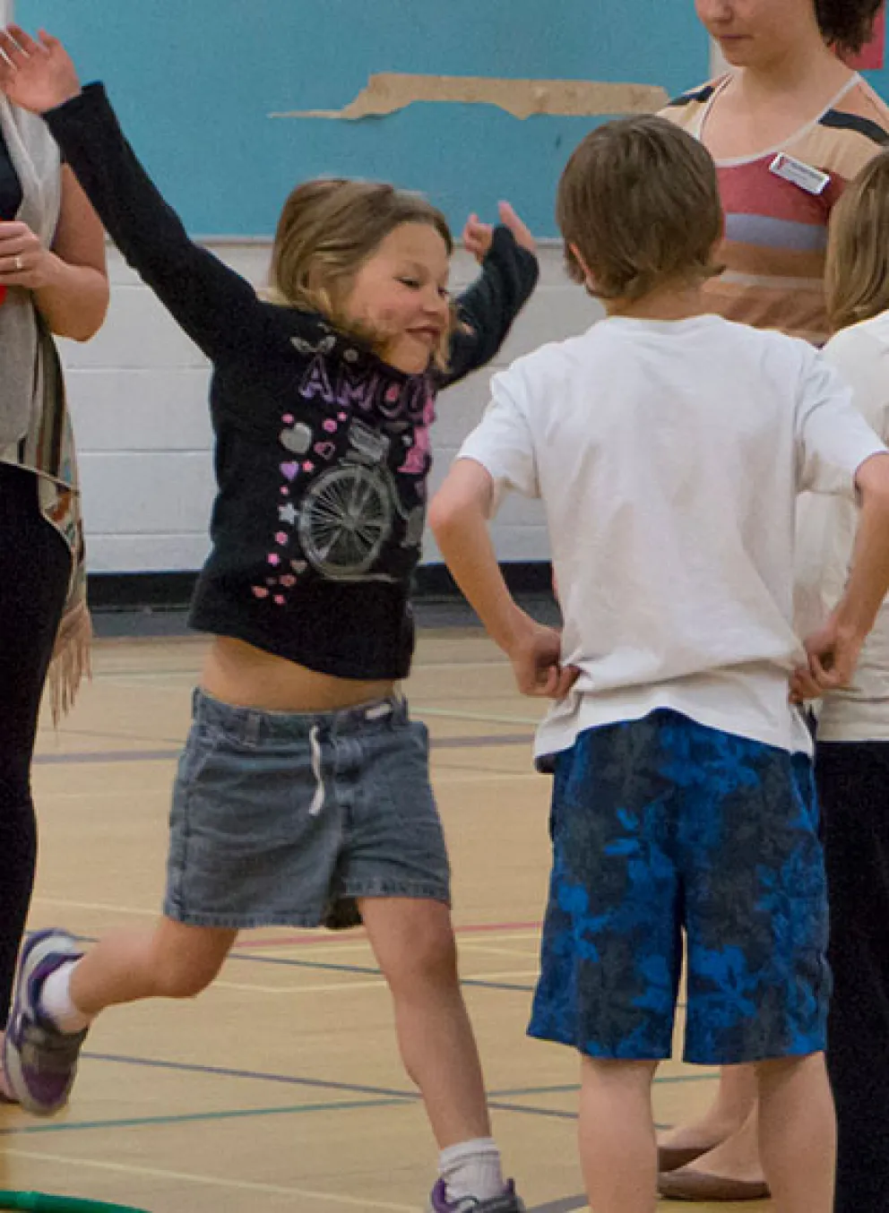 kids playing game with hula hoops and rings