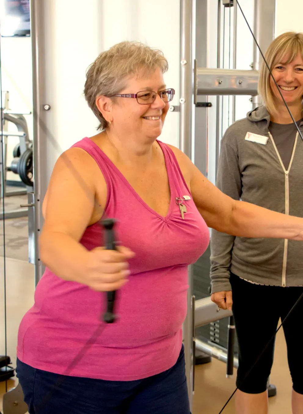 Senior working out with a trainer