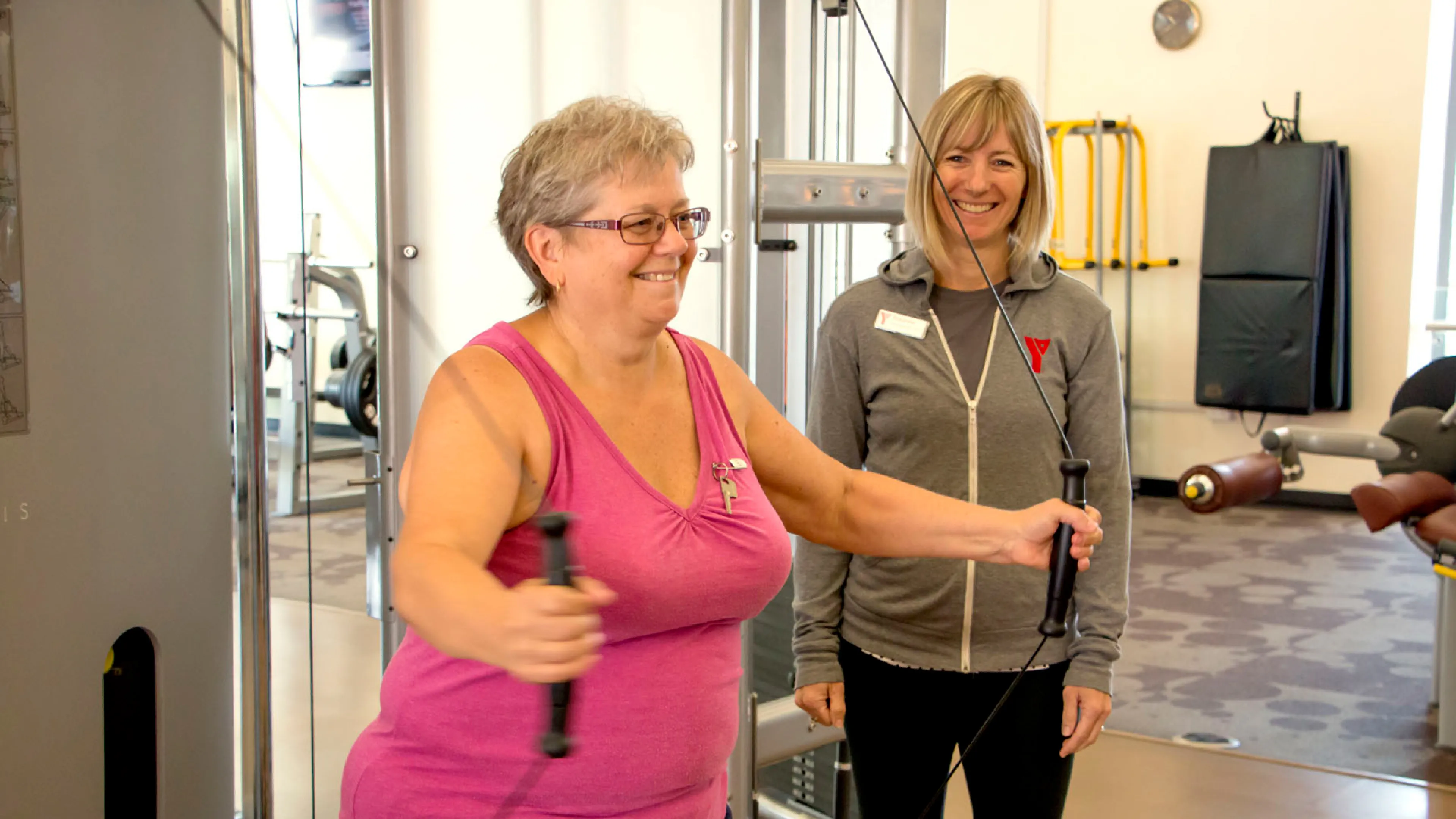 Senior working out with a trainer