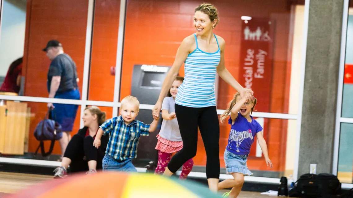 Family smiling and running
