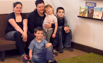 Dannie and kids in YMCA Beyond the Bell reading area