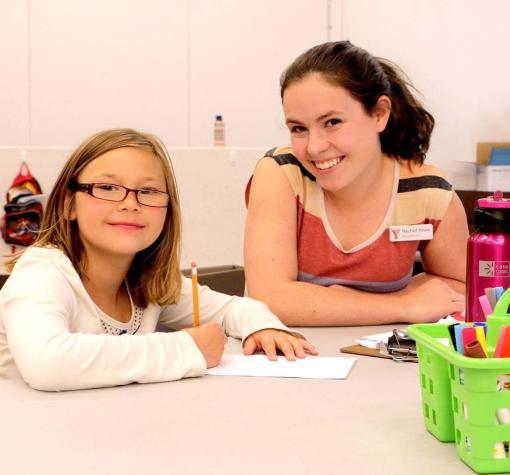 girl getting help with her homework at YMCA Beyond the Bell
