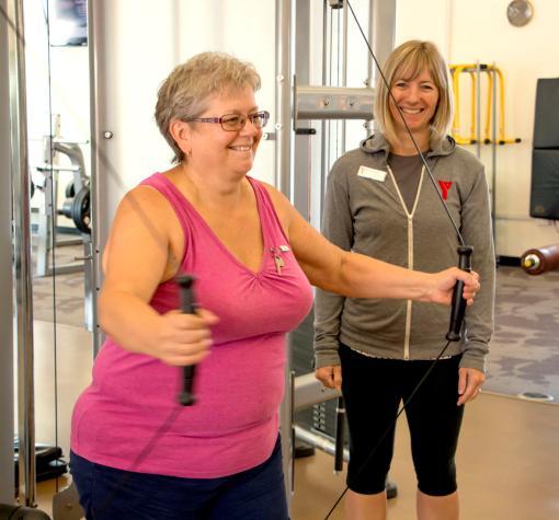 Senior working out with a trainer