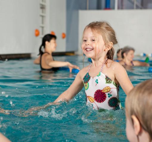 Young girl learning to swim