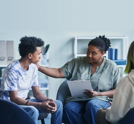 teens get support from adult program facilitator