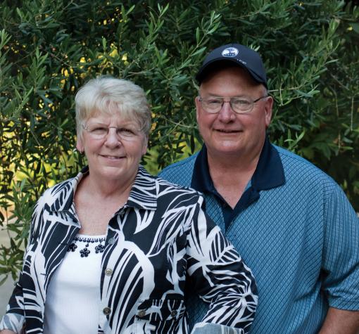 two seniors smiling at camera