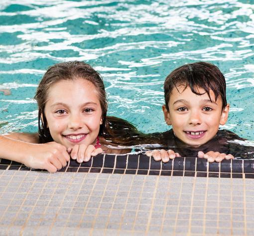 two happy children in a pool
